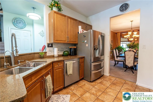 6 Westridge Ct, Middle Smithfield Twp, PA 18302 - kitchen featuring stainless steel appliances, brown cabinets, light stone counters, and light colored carpet