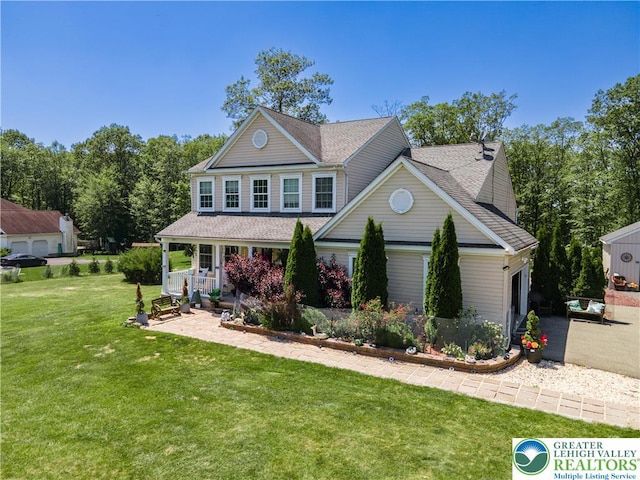 6 Westridge Ct, Middle Smithfield Twp, PA 18302 - view of front of house featuring covered porch, a front lawn, and roof with shingles