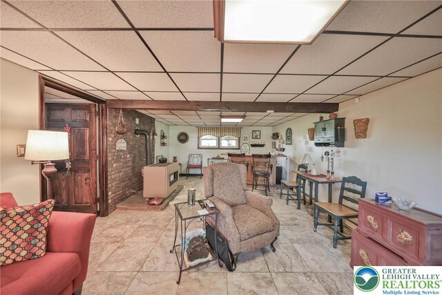 70 Faust N Rd, Pa, PA 19507 - living room with a paneled ceiling and a wood stove