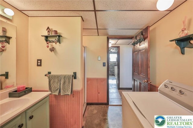 70 Faust N Rd, Pa, PA 19507 - washroom with washer / clothes dryer, a wainscoted wall, and dark tile patterned flooring