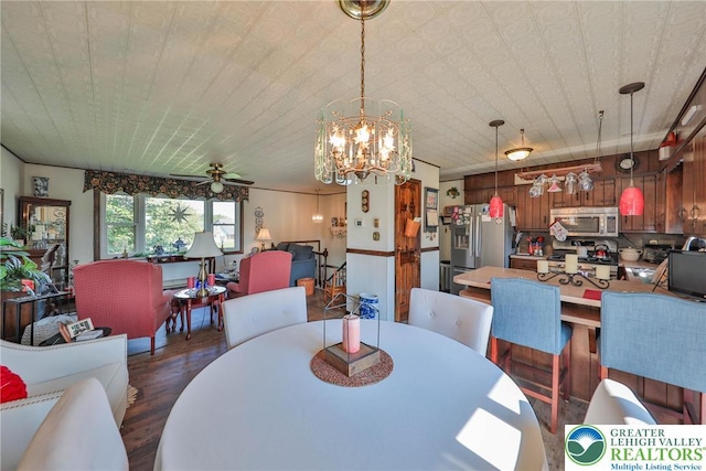 70 Faust N Rd, Pa, PA 19507 - dining area with dark wood finished floors, ceiling fan, a chandelier, and wooden walls