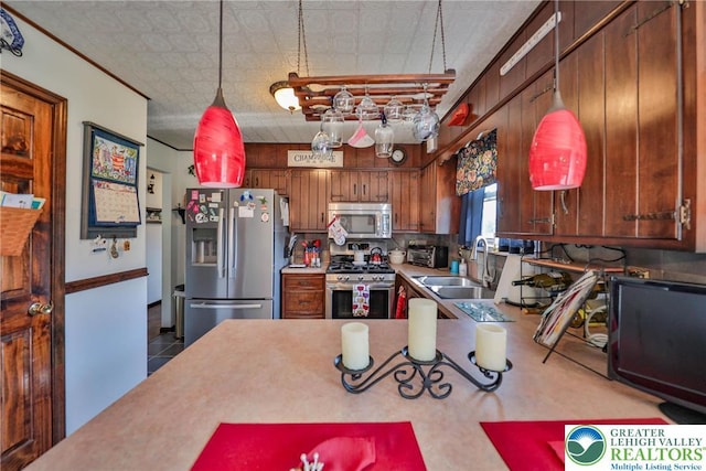 70 Faust N Rd, Pa, PA 19507 - kitchen featuring appliances with stainless steel finishes, light countertops, tasteful backsplash, brown cabinets, and an ornate ceiling