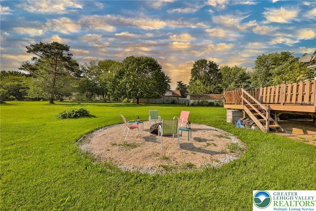 70 Faust N Rd, Pa, PA 19507 - yard at dusk with a lawn, a deck, and view of scattered trees