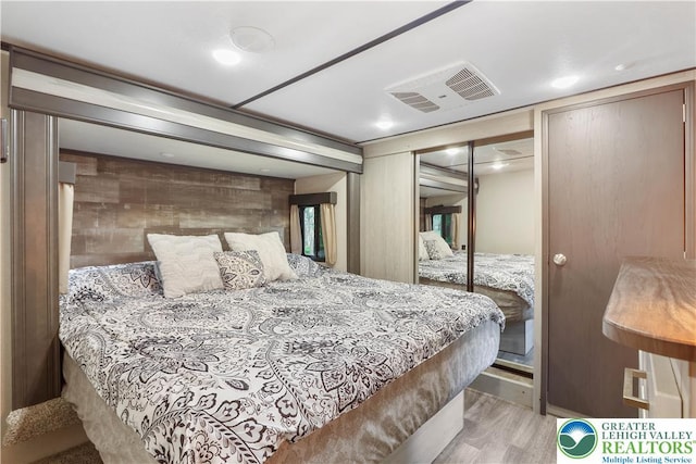 149 Deer Path Ln, Tobyhanna Twp, PA 18346 - bedroom featuring wood finished floors and wooden walls
