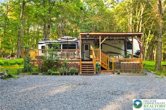 149 Deer Path Ln, Tobyhanna Twp, PA 18346 - view of front of home with a wooden deck
