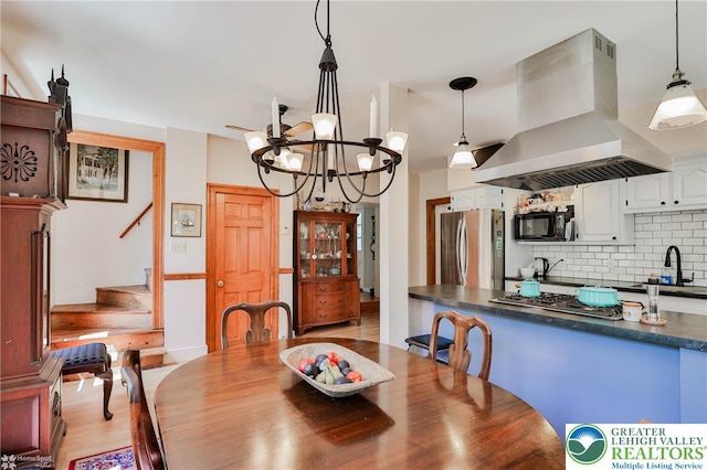 388 Kohls Rd, Allen Twp, PA 18067 - dining space featuring stairway, a chandelier, and light wood finished floors