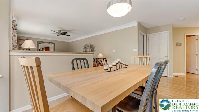 310 Spyglass Hill Rd, Bath Boro, PA 18014 - dining room featuring ceiling fan, light wood finished floors, and ornamental molding