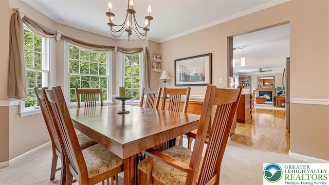 310 Spyglass Hill Rd, Bath Boro, PA 18014 - dining area featuring a chandelier, plenty of natural light, crown molding, and light carpet
