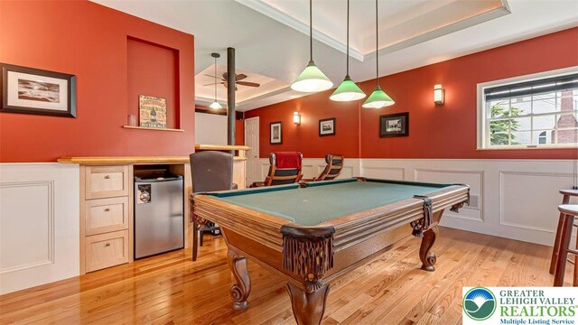 310 Spyglass Hill Rd, Bath Boro, PA 18014 - recreation room featuring a tray ceiling, light wood finished floors, pool table, a decorative wall, and wainscoting