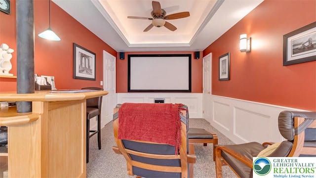 310 Spyglass Hill Rd, Bath Boro, PA 18014 - carpeted home theater room with a ceiling fan, a raised ceiling, a decorative wall, and wainscoting