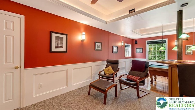 310 Spyglass Hill Rd, Bath Boro, PA 18014 - living area featuring a raised ceiling, a wainscoted wall, a decorative wall, and ceiling fan