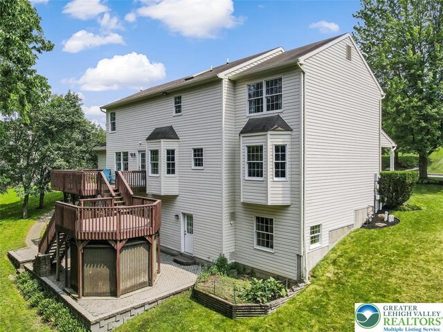 310 Spyglass Hill Rd, Bath Boro, PA 18014 - back of house featuring a deck, stairway, a yard, and a vegetable garden