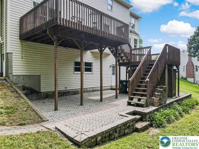 310 Spyglass Hill Rd, Bath Boro, PA 18014 - back of property featuring a patio, a deck, and stairway