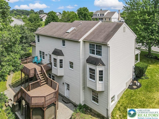 310 Spyglass Hill Rd, Bath Boro, PA 18014 - back of house featuring a deck, a lawn, roof with shingles, and stairs