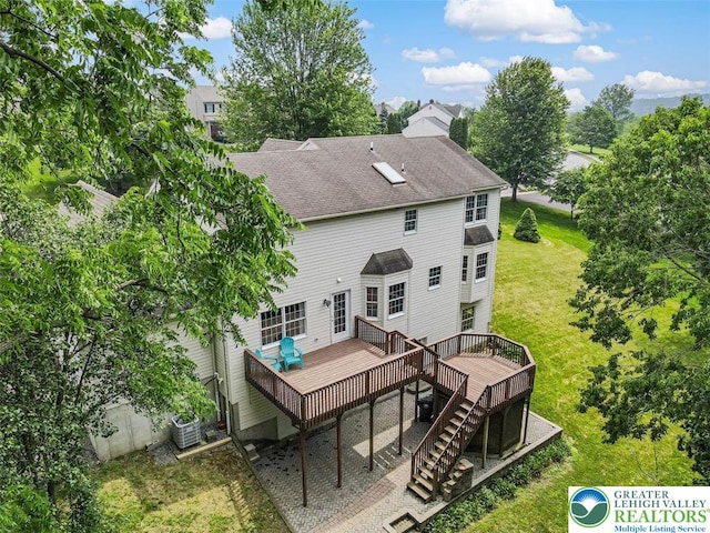 310 Spyglass Hill Rd, Bath Boro, PA 18014 - back of house with a deck, a shingled roof, stairs, a lawn, and a chimney