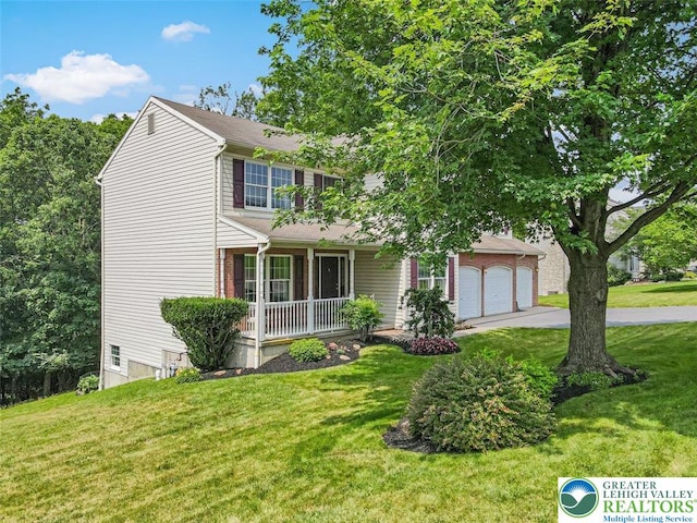 310 Spyglass Hill Rd, Bath Boro, PA 18014 - view of front of property featuring a porch, a front lawn, and a garage