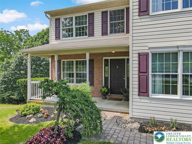 310 Spyglass Hill Rd, Bath Boro, PA 18014 - property entrance with a porch and brick siding