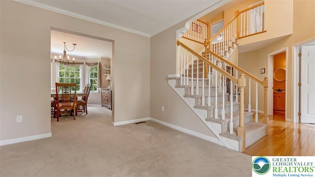 310 Spyglass Hill Rd, Bath Boro, PA 18014 - staircase with ornamental molding, a chandelier, and carpet floors