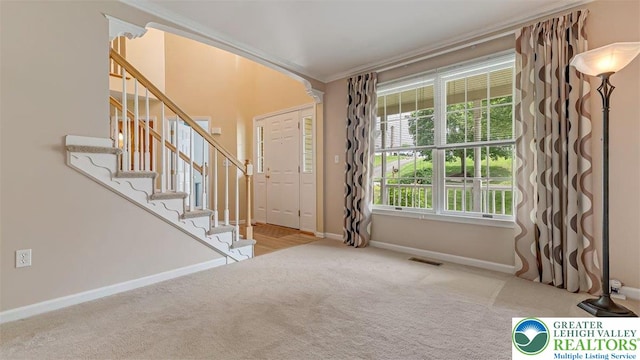 310 Spyglass Hill Rd, Bath Boro, PA 18014 - entryway featuring ornamental molding, carpet floors, and stairway