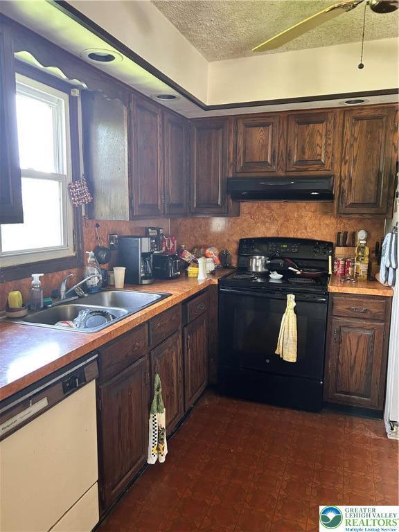 4103 Birch Dr, Bethlehem City, PA 18020 - kitchen featuring black electric range, dishwasher, under cabinet range hood, a textured ceiling, and light countertops