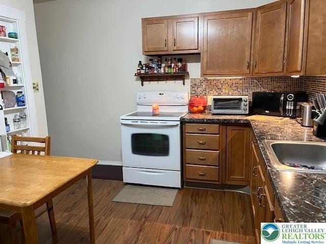418 S 18th St, Allentown City, PA 18104 - kitchen with white electric range, black microwave, dark wood-style flooring, open shelves, and tasteful backsplash