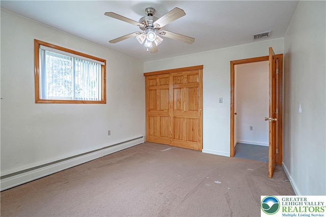 3442 Hickory Cir S, Whitehall Twp, PA 18103 - unfurnished bedroom with a baseboard heating unit, carpet flooring, and ceiling fan