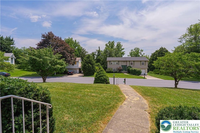 3442 Hickory Cir S, Whitehall Twp, PA 18103 - view of front facade featuring a front yard and view of wooded area
