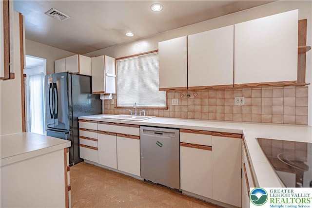 3442 Hickory Cir S, Whitehall Twp, PA 18103 - kitchen with black appliances, light countertops, white cabinetry, decorative backsplash, and recessed lighting