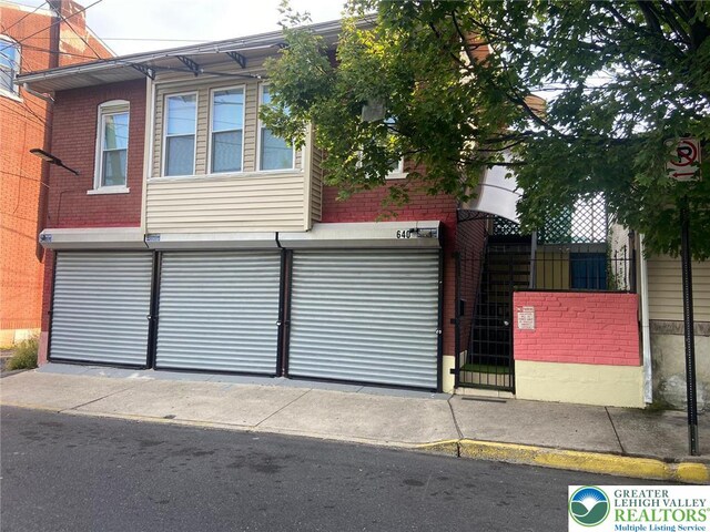 640 Park St, Allentown City, PA 18102 - view of front of home featuring a garage and brick siding