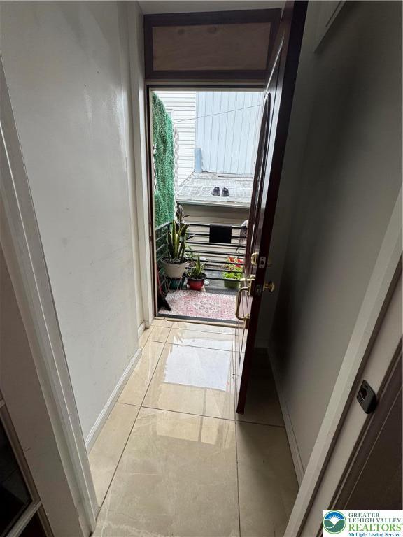 640 Park St, Allentown City, PA 18102 - doorway with baseboards and light tile patterned floors