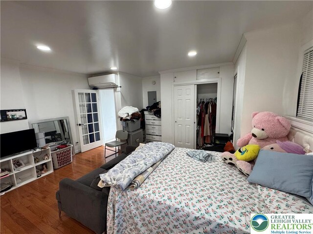 640 Park St, Allentown City, PA 18102 - bedroom featuring a wall mounted air conditioner, wood finished floors, recessed lighting, and a closet