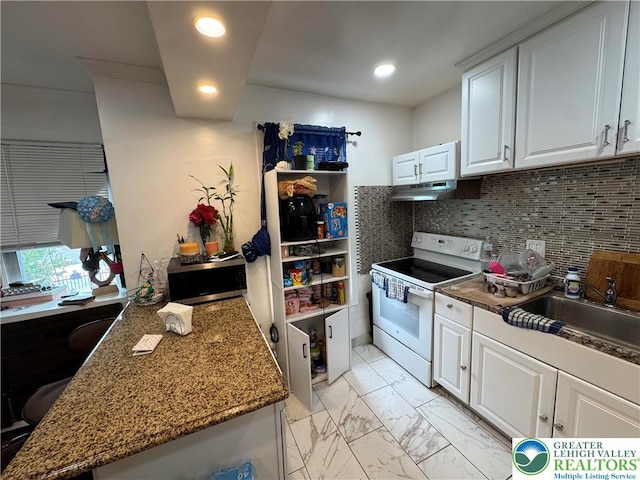 640 Park St, Allentown City, PA 18102 - kitchen featuring white electric range, stainless steel microwave, white cabinets, decorative backsplash, and recessed lighting