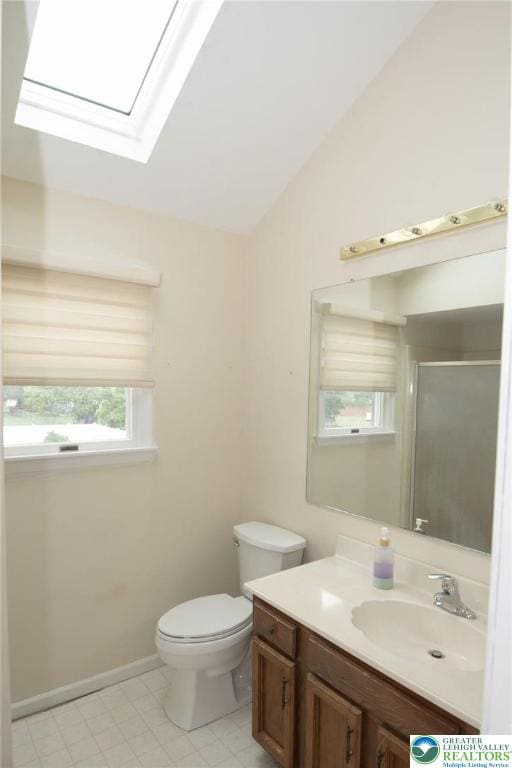 1325 Devon Cir S, Whitehall Twp, PA 18104 - full bathroom with vanity, lofted ceiling, a skylight, and a shower stall