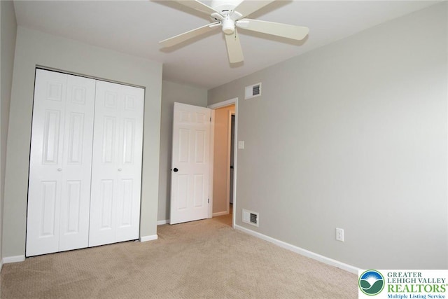 1325 Devon Cir S, Whitehall Twp, PA 18104 - unfurnished bedroom with light colored carpet, a closet, and ceiling fan