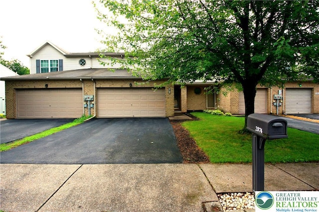 2874 Sequoia Dr, Lower Macungie Twp, PA 18062 - view of front of house featuring brick siding, a front lawn, driveway, and a garage