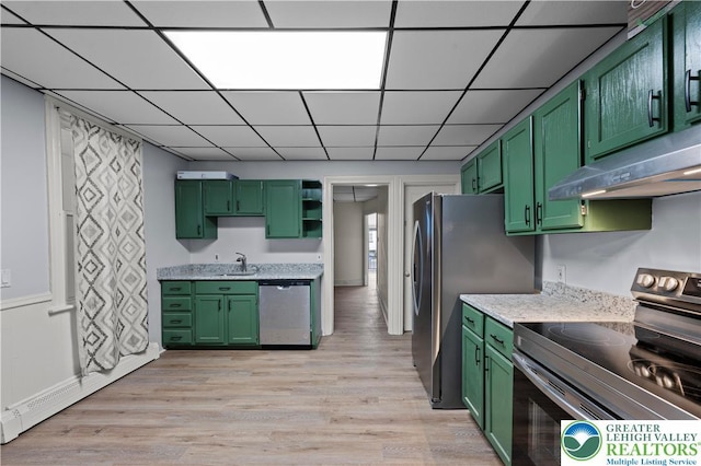 919 Lehigh St, Easton, PA 18042 - kitchen featuring green cabinetry, stainless steel appliances, under cabinet range hood, light wood finished floors, and a drop ceiling