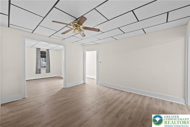 919 Lehigh St, Easton, PA 18042 - unfurnished room with wood finished floors, ceiling fan, and a drop ceiling