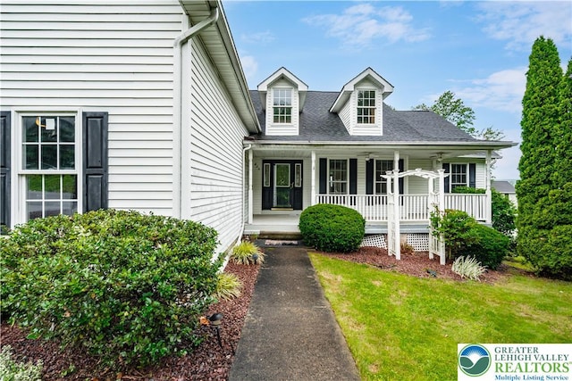 620 Pittston Ave, Luzerne, PA 18641 - new england style home featuring covered porch, a front lawn, and a shingled roof