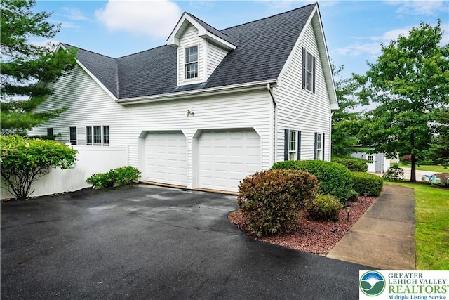 620 Pittston Ave, Luzerne, PA 18641 - view of property exterior with a shingled roof, asphalt driveway, and an attached garage