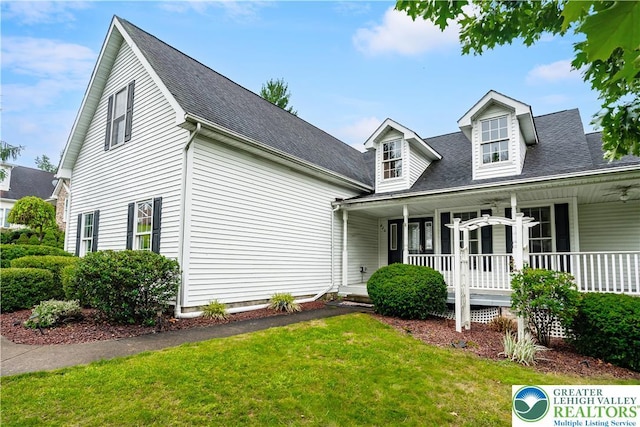 620 Pittston Ave, Luzerne, PA 18641 - cape cod house featuring a porch, a front yard, ceiling fan, and a shingled roof
