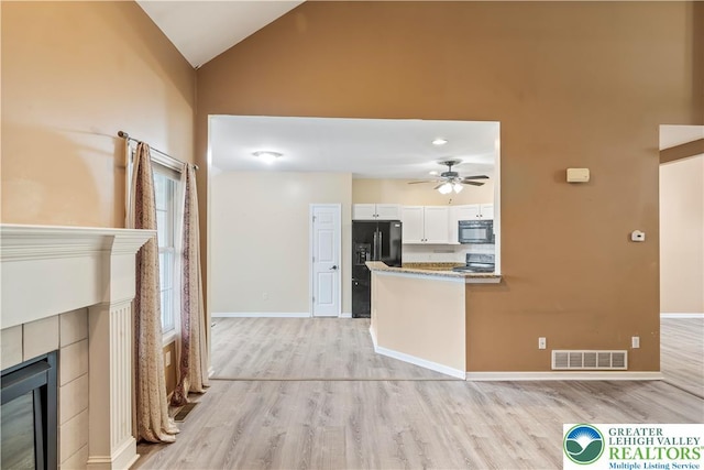 620 Pittston Ave, Luzerne, PA 18641 - kitchen featuring black appliances, light wood finished floors, white cabinetry, high vaulted ceiling, and a ceiling fan