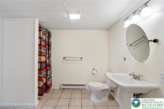 620 Pittston Ave, Luzerne, PA 18641 - bathroom featuring baseboard heating, tile patterned flooring, a paneled ceiling, and curtained shower