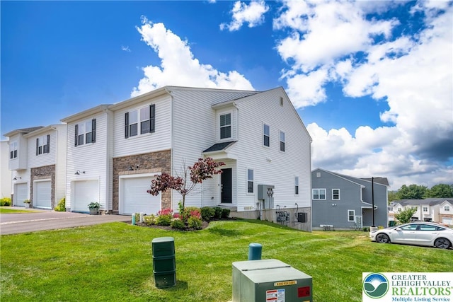 4901 Brookside Ct, Upper Saucon Twp, PA 18036 - view of front of property featuring driveway, a garage, stone siding, a front lawn, and a residential view
