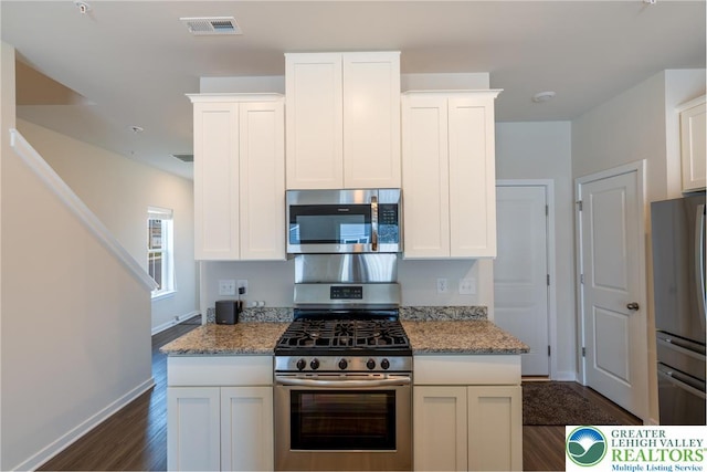 4901 Brookside Ct, Upper Saucon Twp, PA 18036 - kitchen featuring stainless steel appliances, dark wood finished floors, white cabinets, and light stone countertops