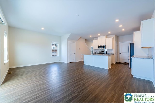 4901 Brookside Ct, Upper Saucon Twp, PA 18036 - kitchen featuring stainless steel appliances, open floor plan, white cabinetry, a center island with sink, and recessed lighting