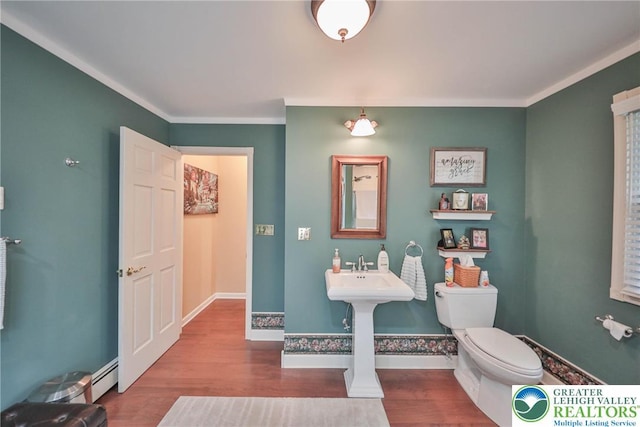1812 Treeline Dr, Forks Twp, PA 18040 - half bathroom with wood finished floors, a baseboard heating unit, and ornamental molding
