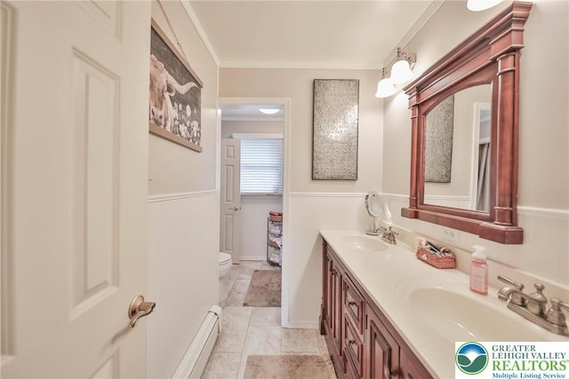 1812 Treeline Dr, Forks Twp, PA 18040 - bathroom with double vanity, a baseboard heating unit, and crown molding