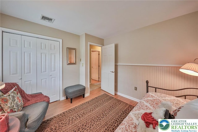 1812 Treeline Dr, Forks Twp, PA 18040 - bedroom featuring wainscoting, wood finished floors, and a closet
