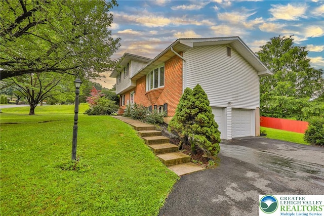 1812 Treeline Dr, Forks Twp, PA 18040 - view of home's exterior featuring driveway, a garage, and brick siding