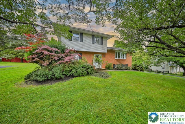 1812 Treeline Dr, Forks Twp, PA 18040 - tri-level home with a yard and brick siding
